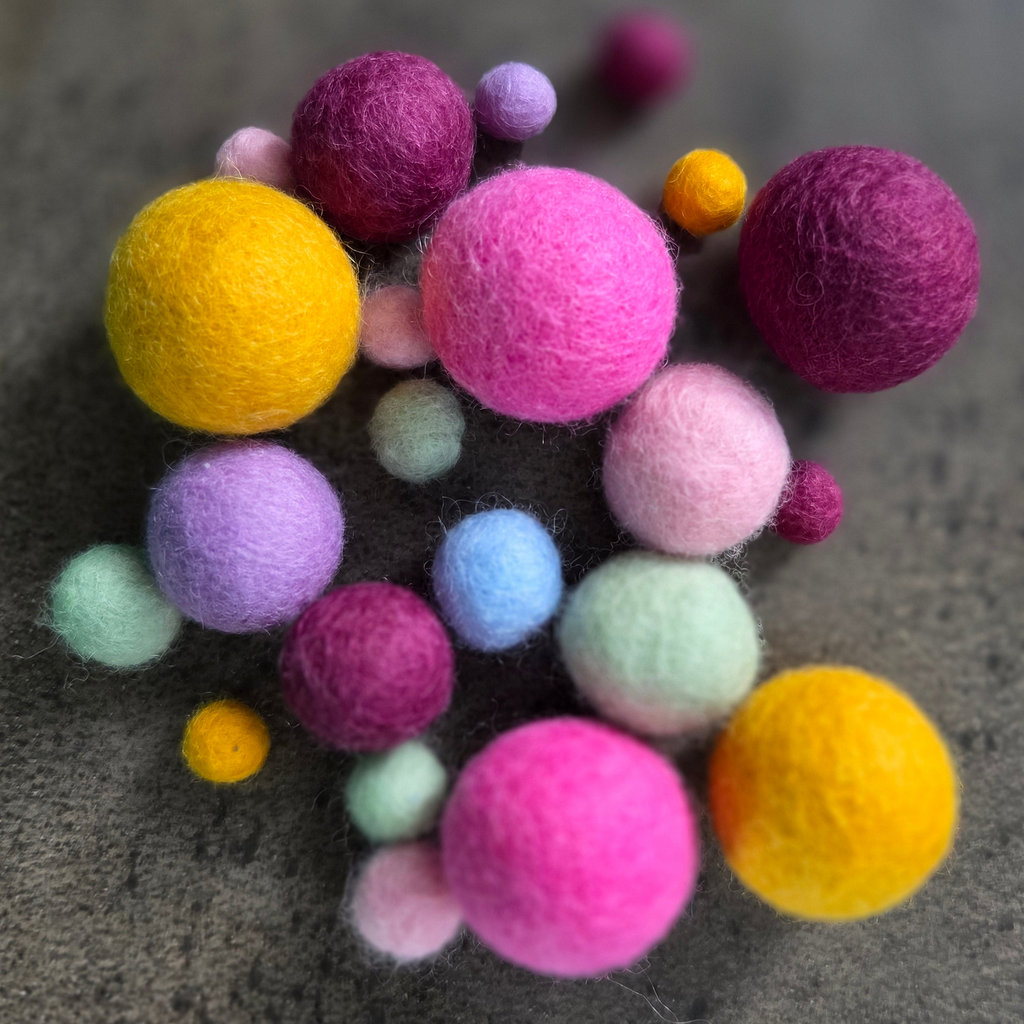 Variety of different colour and size felt balls
