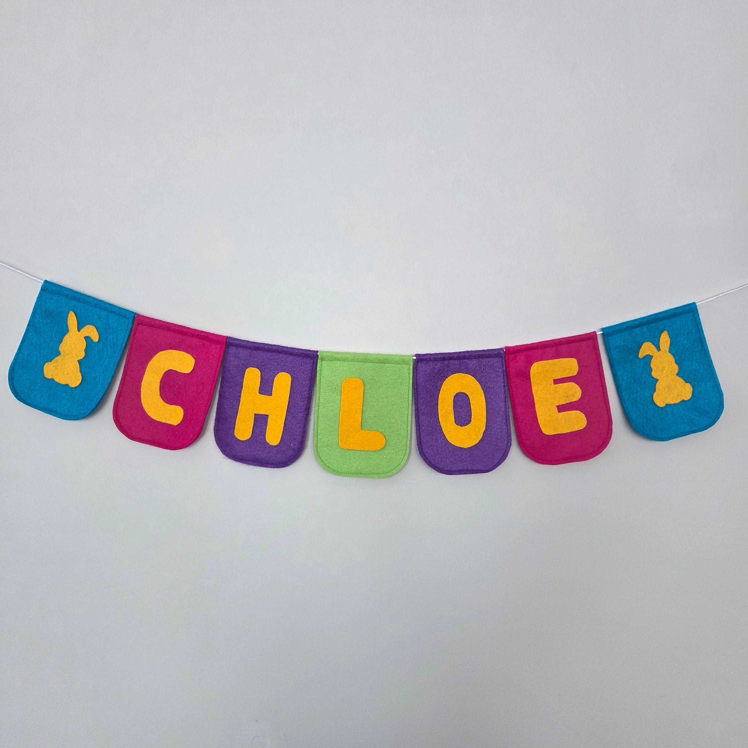 Felt banner colourful with the name CHLOE and two bunnies in yellow