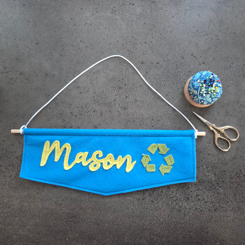 Name banner Blue with yellow name Mason and green recycling symbol 