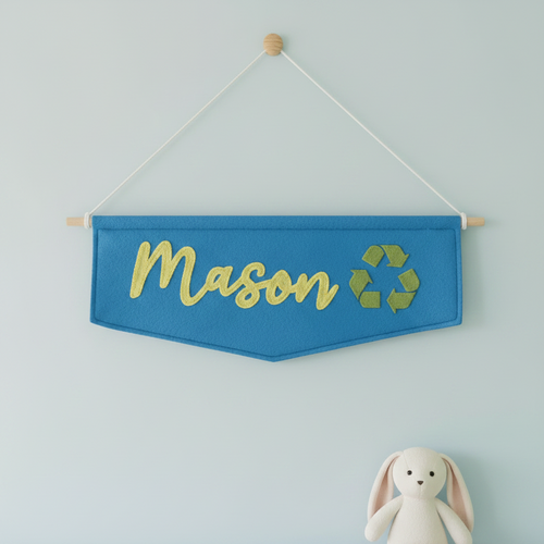 Name banner with Mason hanging. Stuffed bunny in fore ground